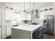 Bright kitchen with stainless steel appliances, white cabinets, and a center island with seating at 1378 Lochland Se Rd, Atlanta, GA 30316