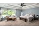 Relaxing main bedroom offers ample natural light, tray ceilings, and a cozy sitting area at 1378 Lochland Se Rd, Atlanta, GA 30316