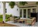 Inviting outdoor patio with comfortable seating and a patterned tile floor at 1378 Lochland Se Rd, Atlanta, GA 30316