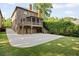 Brick home with spacious backyard featuring patio and garage with room for multiple cars at 2017 Harts Mill Ne Rd, Chamblee, GA 30341