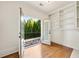 Spacious room with open doors leading to a balcony with tree views at 2017 Harts Mill Ne Rd, Chamblee, GA 30341