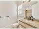 Elegant bathroom with granite countertop, shuttered window, and a tiled shower at 2017 Harts Mill Ne Rd, Chamblee, GA 30341