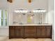 Bathroom showcasing a dual sink vanity, tile floors, and natural light at 2017 Harts Mill Ne Rd, Chamblee, GA 30341