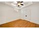 Bedroom with a ceiling fan, hardwood flooring, and large closet with double doors at 2017 Harts Mill Ne Rd, Chamblee, GA 30341
