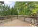 Well-maintained wooden deck with railing overlooking lush greenery and landscaping at 2017 Harts Mill Ne Rd, Chamblee, GA 30341