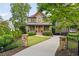 Beautiful brick home with a long driveway, manicured lawn, and lush landscaping at 2017 Harts Mill Ne Rd, Chamblee, GA 30341