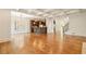 Open-concept living space with hardwood flooring, kitchen island, and coffered ceilings at 2017 Harts Mill Ne Rd, Chamblee, GA 30341