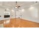 Bedroom with hardwood floors, tray ceiling, ceiling fan, and access to the ensuite bathroom at 2017 Harts Mill Ne Rd, Chamblee, GA 30341