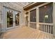 Exterior view of an outdoor living space with double glass doors and screen doors leading to the screened-in porch at 2017 Harts Mill Ne Rd, Chamblee, GA 30341
