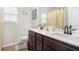 Elegant bathroom with dual sinks, modern fixtures, and bright lighting at 35 Henson Farm Dr, Loganville, GA 30052
