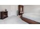 Cozy bedroom featuring a modern electric fireplace, stylish furniture, and plush carpeting at 35 Henson Farm Dr, Loganville, GA 30052