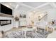 Elegant living room with a fireplace, coffered ceiling, and luxury furniture at 35 Henson Farm Dr, Loganville, GA 30052