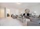 Inviting living room featuring a modern sofa, chairs, and decor at 35 Henson Farm Dr, Loganville, GA 30052
