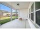 Bright patio with floor-to-ceiling windows and a view of the yard at 35 Henson Farm Dr, Loganville, GA 30052