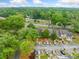 Scenic aerial view showcases the property, parking, and a lush green landscape at 3765 Windsor Cir, Clarkston, GA 30021