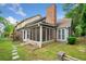 A spacious backyard features a screened-in porch and stepping stone path at 3765 Windsor Cir, Clarkston, GA 30021