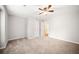 Neutral bedroom with plush carpeting, ample space, and two doors at 3765 Windsor Cir, Clarkston, GA 30021