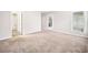 Bedroom with carpet and natural light from a window, with access to a bathroom and closet at 3765 Windsor Cir, Clarkston, GA 30021