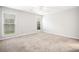 Spacious bedroom with neutral carpet, two windows bringing in plenty of natural light at 3765 Windsor Cir, Clarkston, GA 30021