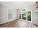 Bright dining room with views of the well-manicured yard, next to a kitchen at 3765 Windsor Cir, Clarkston, GA 30021