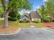 Attractive home with a well-manicured lawn, beautiful landscaping, and a convenient parking area at 3765 Windsor Cir, Clarkston, GA 30021