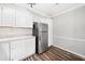This kitchen features stainless steel appliances, light countertops, and wood-look flooring at 3765 Windsor Cir, Clarkston, GA 30021