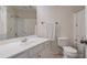 Neutral bathroom with white vanity, framed mirror, and a shower and tub with butterfly curtain at 5375 Glenhaven Dr, Cumming, GA 30041