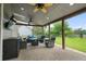 Covered patio with comfortable seating and a ceiling fan perfect for outdoor entertaining at 5375 Glenhaven Dr, Cumming, GA 30041