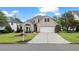 Charming brick home with well-manicured lawn, mature landscaping, and a two-car garage at 5375 Glenhaven Dr, Cumming, GA 30041