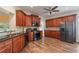 Spacious kitchen featuring wood cabinets, stainless steel appliances, and hardwood floors at 5375 Glenhaven Dr, Cumming, GA 30041