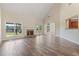 Spacious living room boasting hardwood floors, a fireplace, and vaulted ceilings for an airy feel at 5375 Glenhaven Dr, Cumming, GA 30041