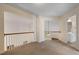Upstairs loft area with views of the lower level, plus a bathroom with a white vanity and tile floors at 5375 Glenhaven Dr, Cumming, GA 30041