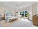 The spacious main bedroom has a trey ceiling, a ceiling fan, and a large window at 5375 Glenhaven Dr, Cumming, GA 30041