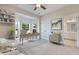 Home office includes a bay window, desk, and a view of the bathroom at 5375 Glenhaven Dr, Cumming, GA 30041