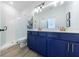 Modern bathroom featuring double sink vanity, matte brass finishes, and glass shower at 1624 Gunnin Nw Trce, Atlanta, GA 30318