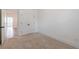 Bedroom featuring soft carpet, an open door and spacious closet at 1624 Gunnin Nw Trce, Atlanta, GA 30318