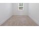 Bedroom featuring neutral carpeting, bright white trim, and a single window at 1624 Gunnin Nw Trce, Atlanta, GA 30318