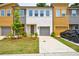Modern townhome featuring colorful exteriors, well-manicured lawns and a private, attached garage at 1624 Gunnin Nw Trce, Atlanta, GA 30318