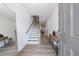 Bright foyer features wood-look floors, staircase, a mirror and decorative console table at 1624 Gunnin Nw Trce, Atlanta, GA 30318