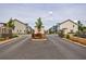 Gated community entrance with landscaping, offering secure access to the attractive townhome community at 1624 Gunnin Nw Trce, Atlanta, GA 30318