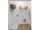 Bright laundry room with utility sink hookups, wire rack shelving and wood-look floors at 1624 Gunnin Nw Trce, Atlanta, GA 30318