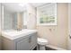 Charming bathroom with a single sink vanity, mirror, and shower at 2771 Dresden Trl, Atlanta, GA 30344