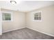 Comfortable bedroom with two windows, carpet flooring, and neutral wall color at 2771 Dresden Trl, Atlanta, GA 30344