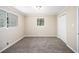 Comfortable bedroom with two windows, a closet, carpet flooring, and neutral wall color at 2771 Dresden Trl, Atlanta, GA 30344