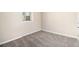 Simple bedroom featuring carpeted floors, natural light, and neutral colored walls and trim at 2771 Dresden Trl, Atlanta, GA 30344