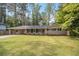Charming single story home featuring a spacious manicured lawn and covered parking at 2771 Dresden Trl, Atlanta, GA 30344