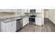 Modern kitchen with stainless steel appliances, granite countertops, and white cabinets at 2771 Dresden Trl, Atlanta, GA 30344