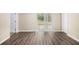 Bright living area showcasing sliding glass doors leading to an outdoor space and wood floors at 2771 Dresden Trl, Atlanta, GA 30344