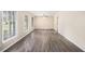 Bright and open living room featuring wood floors and large windows providing ample natural light at 2771 Dresden Trl, Atlanta, GA 30344