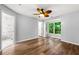 Bedroom features wood flooring, light gray walls, large window and en suite bathroom at 3019 Camden Way, Alpharetta, GA 30005
